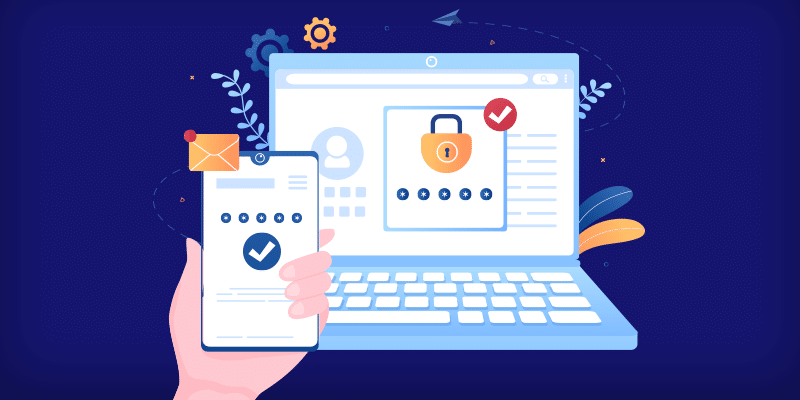 A hand holds a smartphone showing a green checkmark, positioned in front of an open laptop screen featuring a large padlock icon, visually conveying secure two-factor authentication used to protect business or SaaS platform accounts.