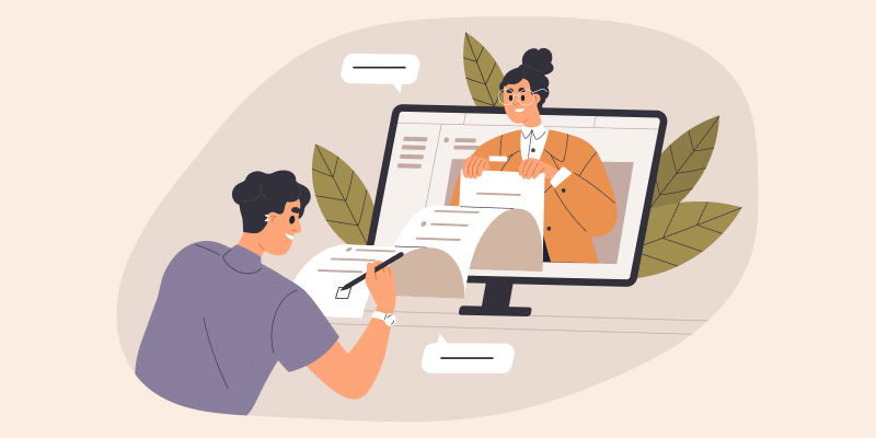 Person at a desk signs documents while digitally exchanging paperwork with another on a computer screen to streamline SaaS renewals.